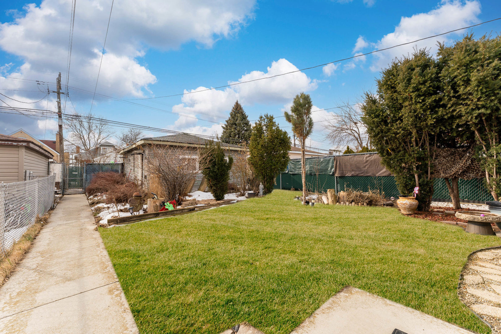 5815 West School Street Chicago, IL 60634 - Photo 19 of 20 a backyard of a house with table and chairs