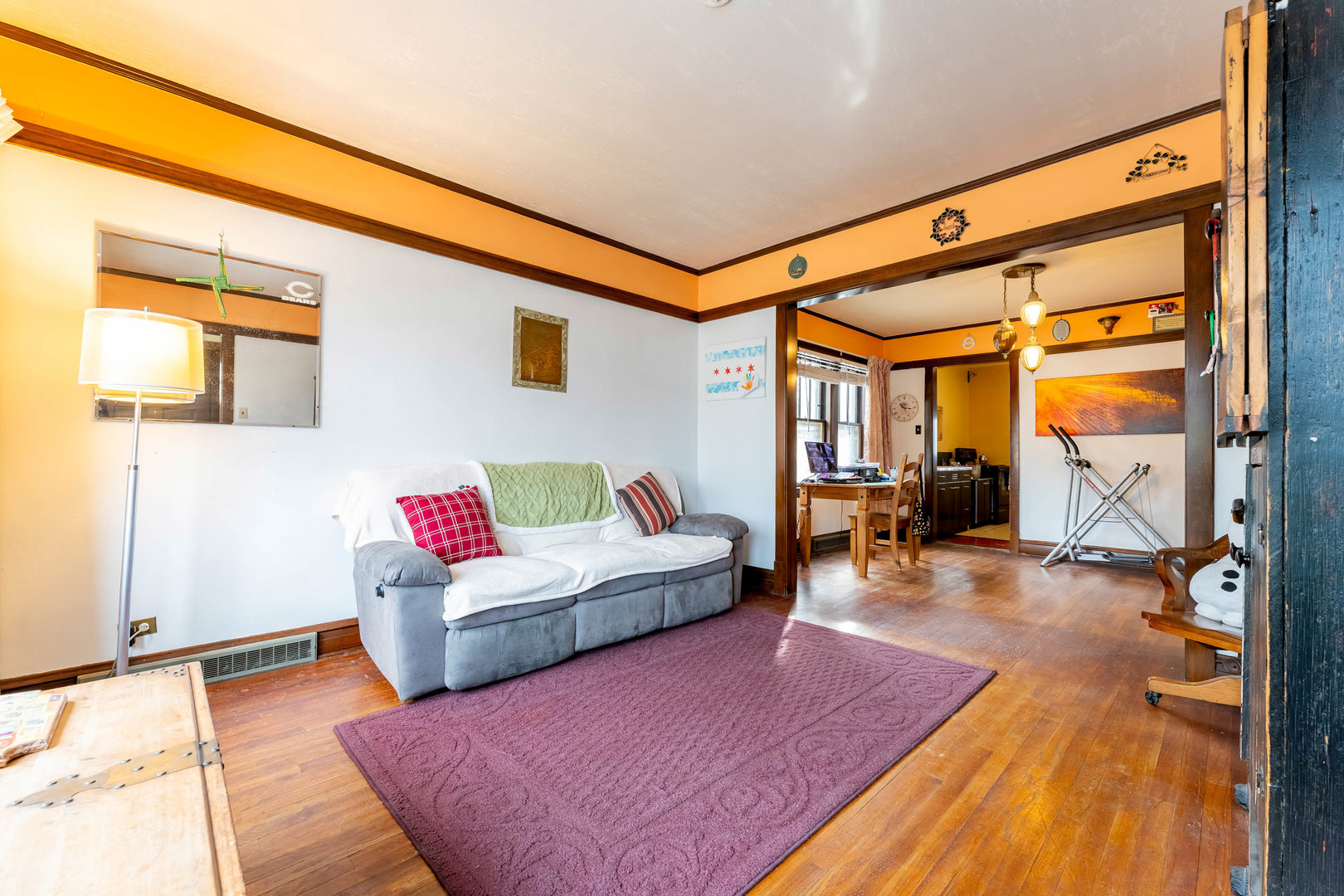 5815 West School Street Chicago, IL 60634 - Photo 2 of 20 a living room with furniture a rug and a floor to ceiling window