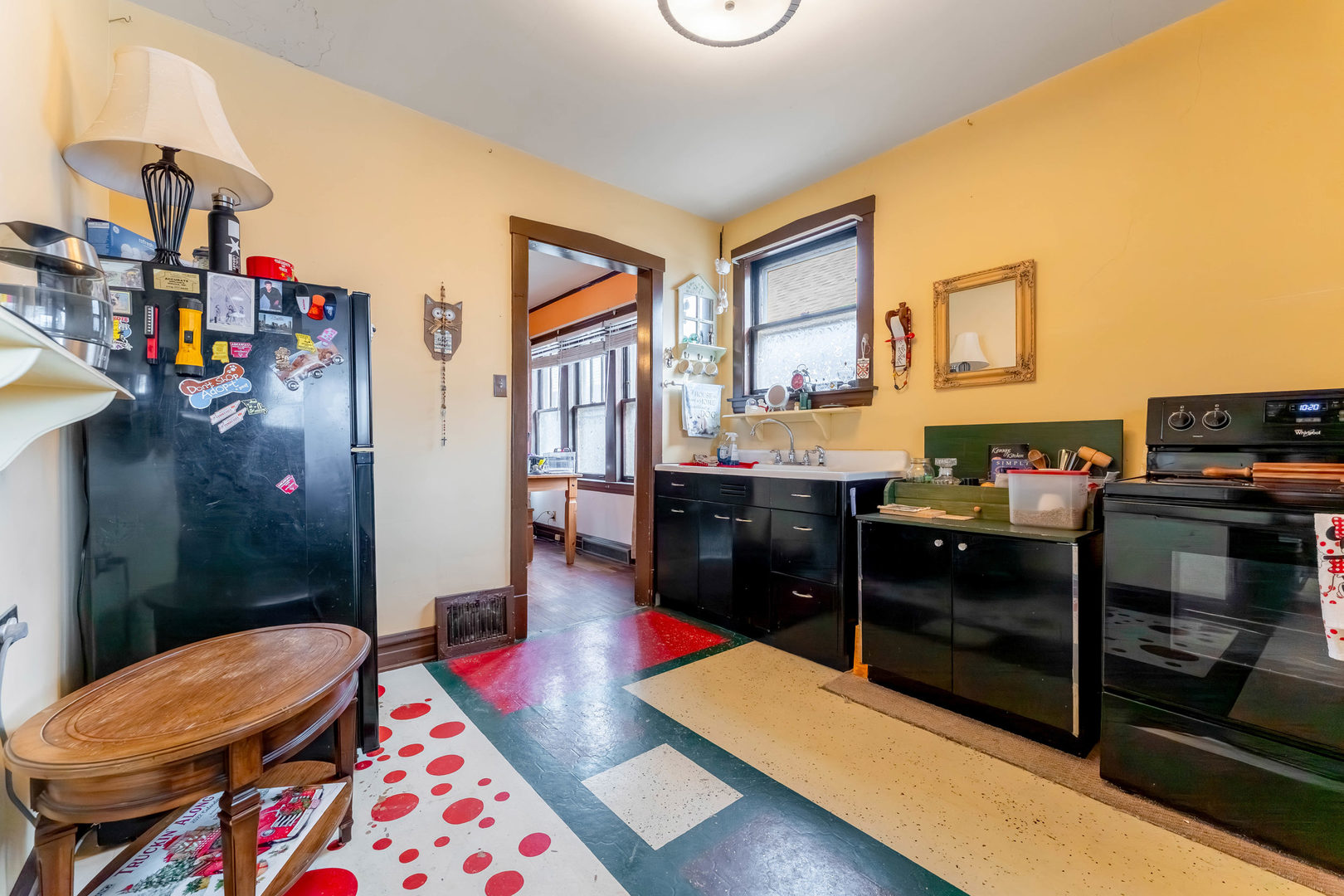 5815 West School Street Chicago, IL 60634 - Photo 8 of 20 a living room with baby crib furniture and a table