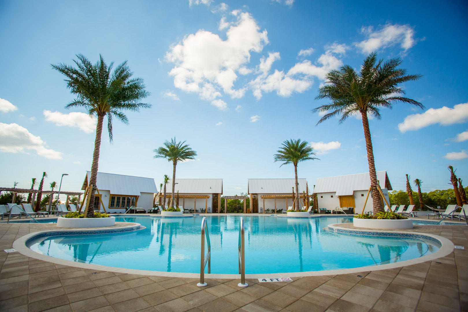 138 Pine Lands Loop Inlet Beach, Unit B Inlet Beach, FL 32461 - Photo 26 of 32 a view of a swimming pool with a table and chair