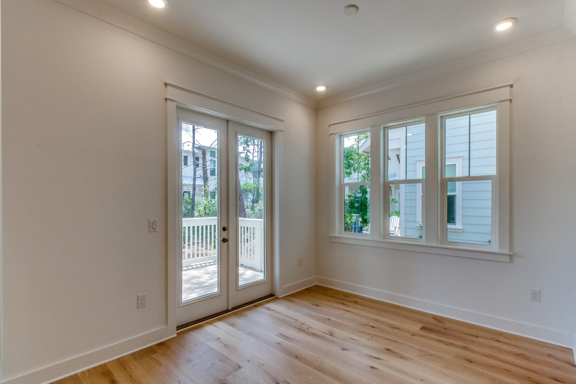 138 Pine Lands Loop Inlet Beach, Unit B Inlet Beach, FL 32461 - Photo 8 of 32 an empty room with wooden floor and windows