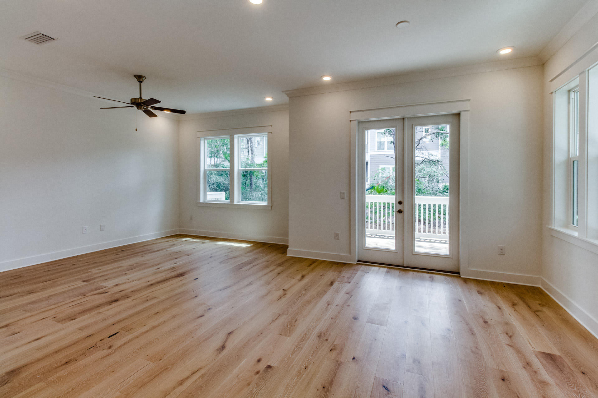 138 Pine Lands Loop Inlet Beach, Unit B Inlet Beach, FL 32461 - Photo 9 of 32 a view of an empty room with wooden floor and a window