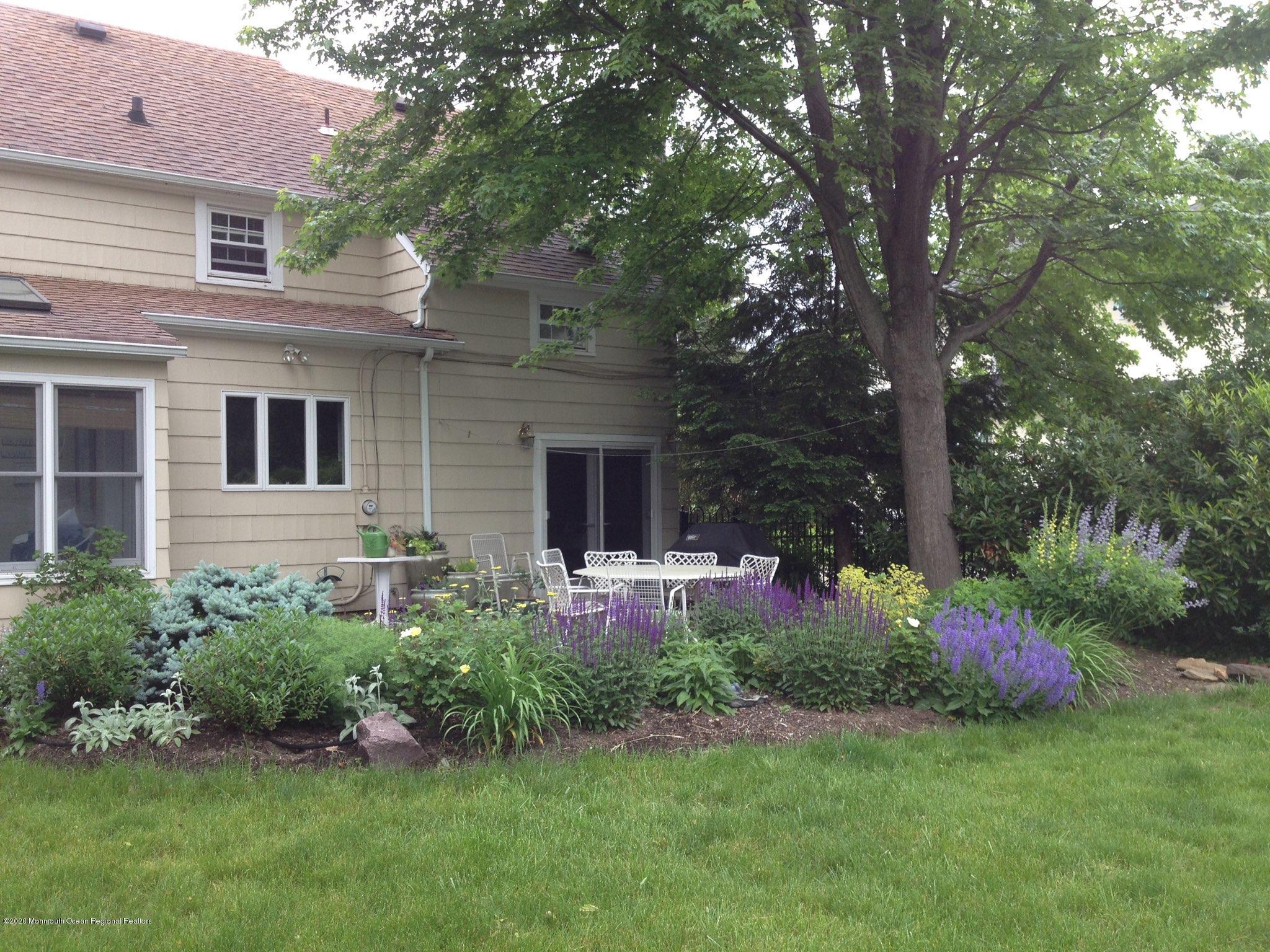 73 Pinckney Road Red Bank, NJ 07701 - Photo 24 of 26 Patio Surrounded by Beautiful Flowers