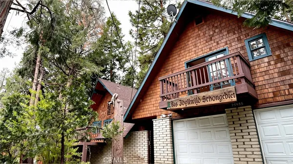 a view of a house with a tree