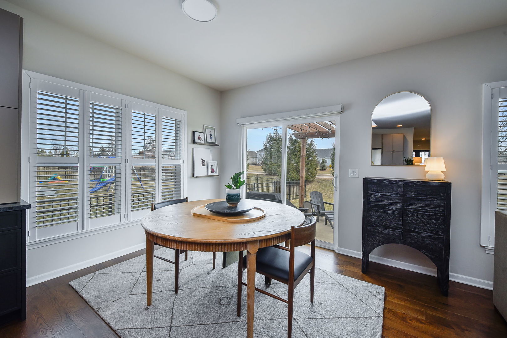 713 Elizabeth Street Elburn, IL 60119 - Photo 15 of 31 a view of a dining room with furniture window and wooden floor