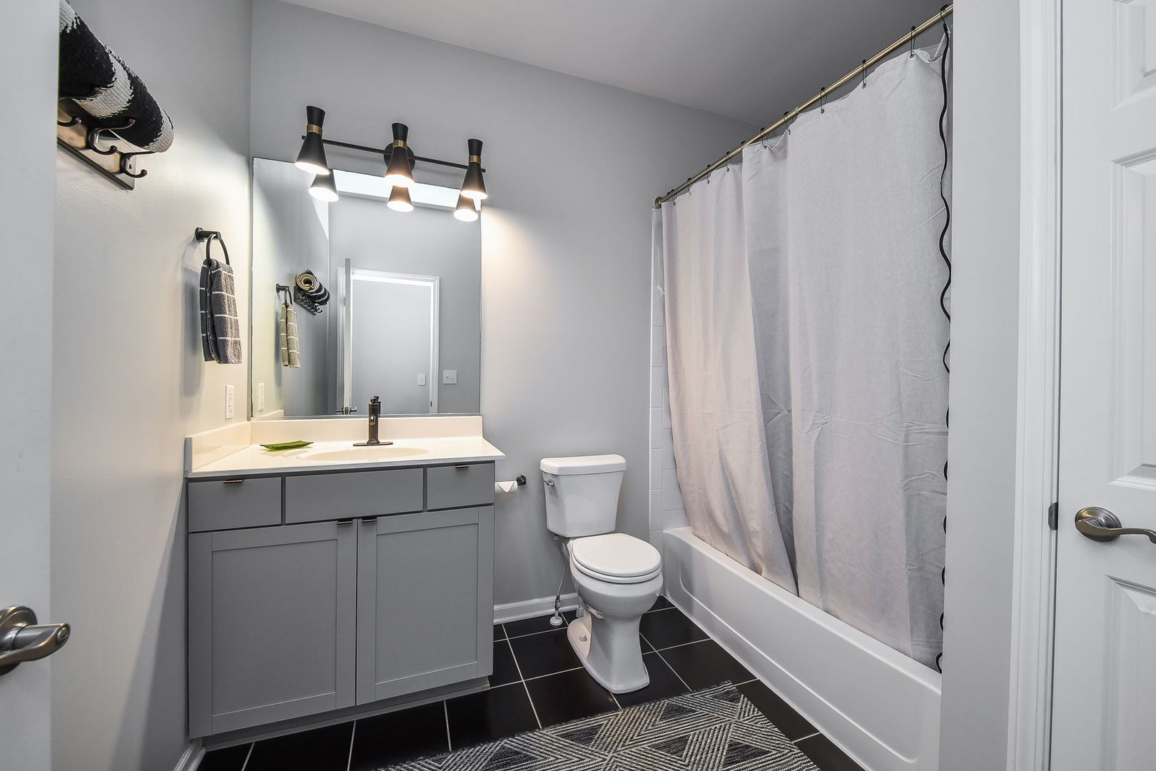 713 Elizabeth Street Elburn, IL 60119 - Photo 18 of 31 a bathroom with a sink and mirror with toilet
