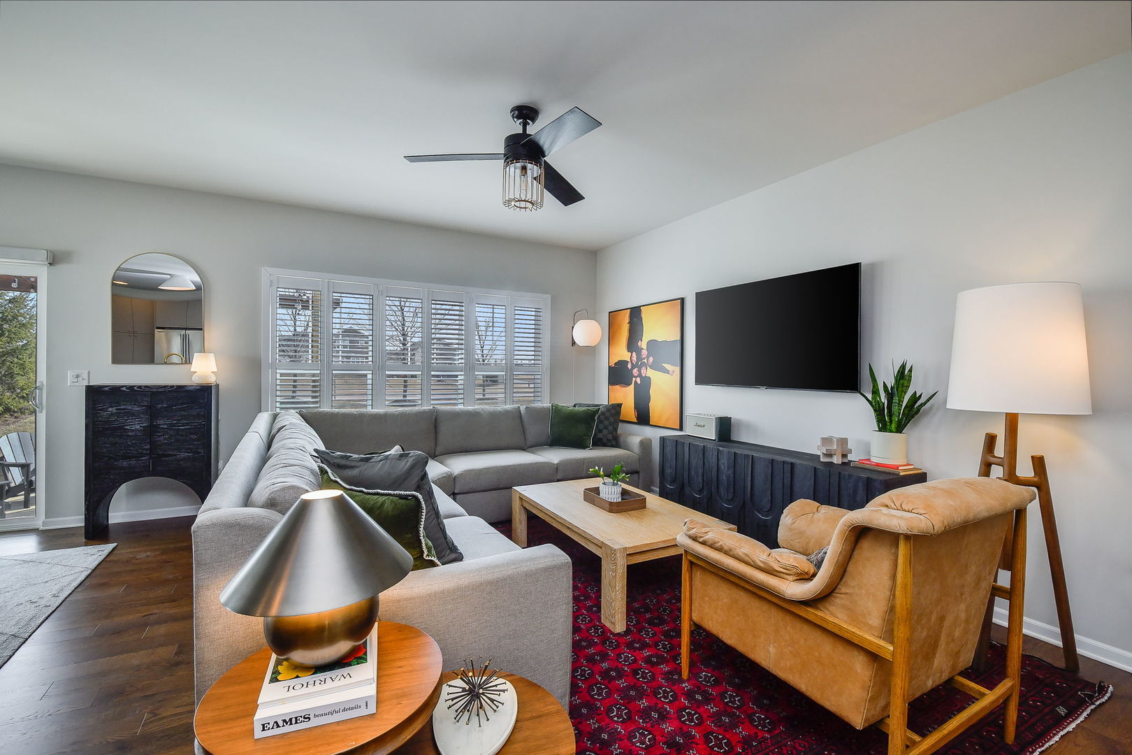 713 Elizabeth Street Elburn, IL 60119 - Photo 5 of 31 a living room with furniture ceiling fan and a flat screen tv