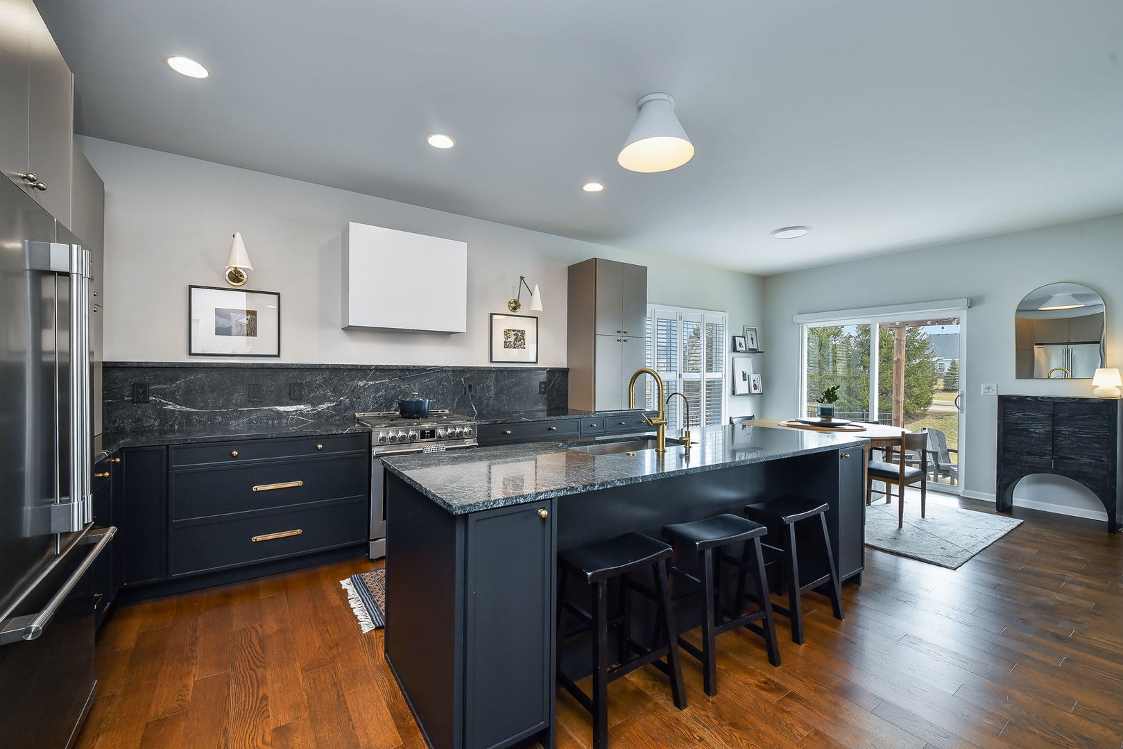 713 Elizabeth Street Elburn, IL 60119 - Photo 8 of 31 a kitchen with stainless steel appliances granite countertop a sink and dishwasher a stove with wooden floor