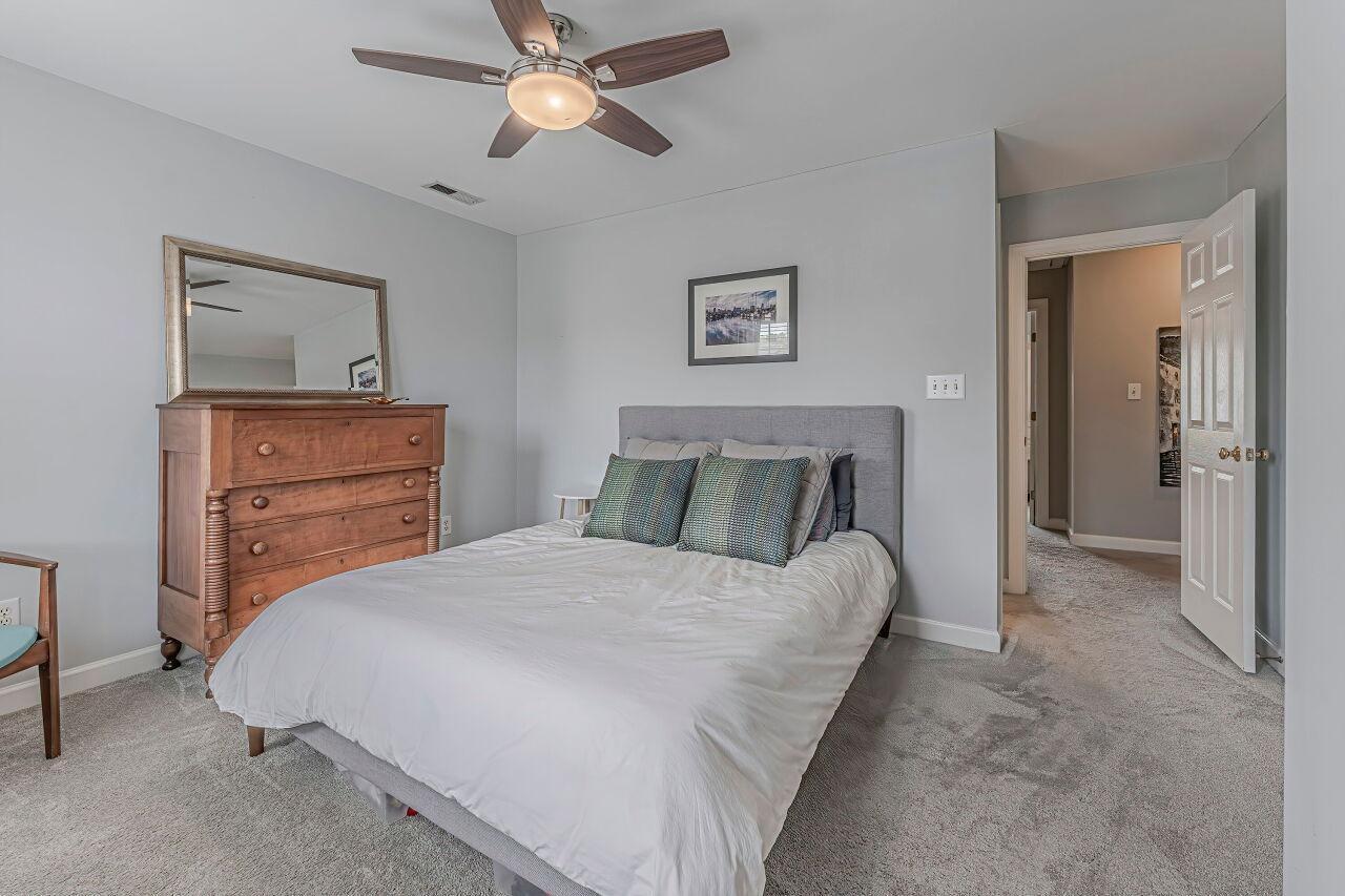 106 Hatfield Lane Raleigh, NC 27603 - Photo 17 of 29 a bedroom with a bed and a dresser