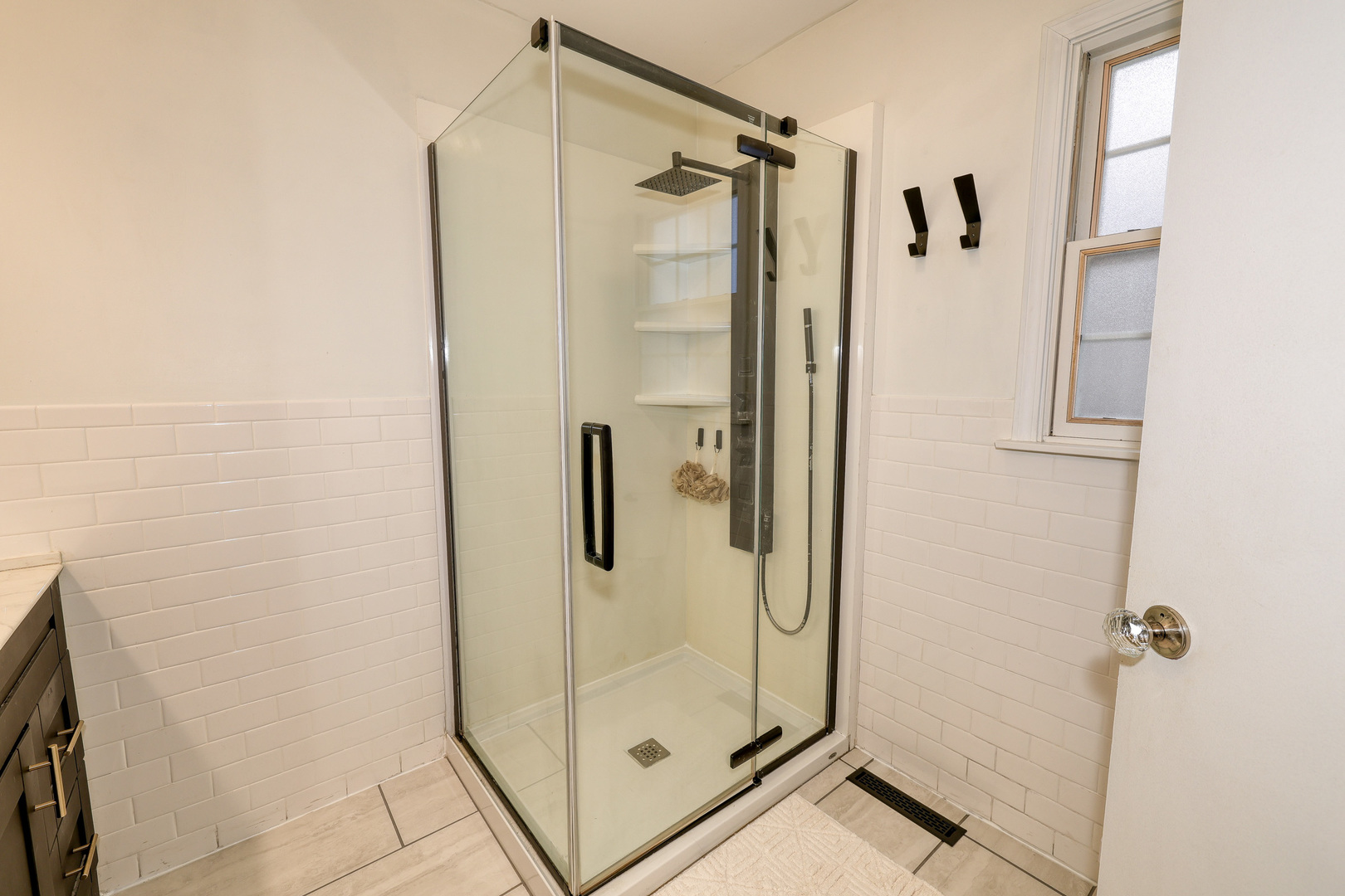 724 South Jefferson Street Batavia, IL 60510 - Photo 16 of 23 a bathroom with a shower and a glass door