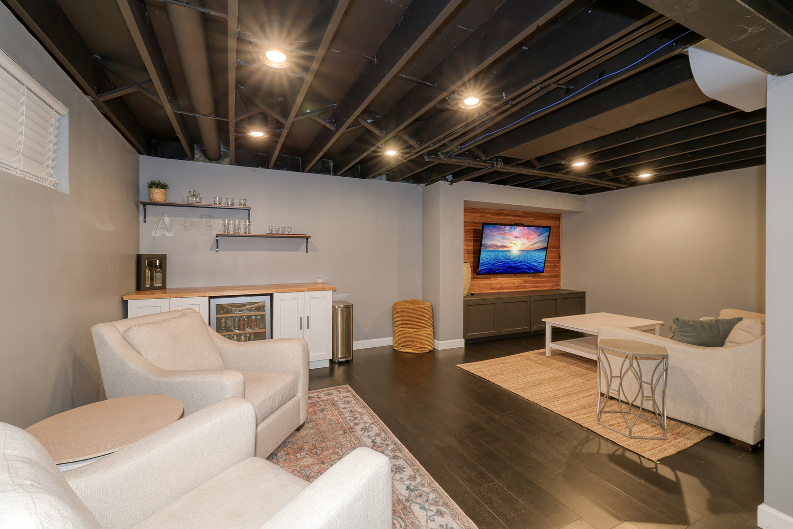 724 South Jefferson Street Batavia, IL 60510 - Photo 20 of 23 a living room with furniture and a flat screen tv