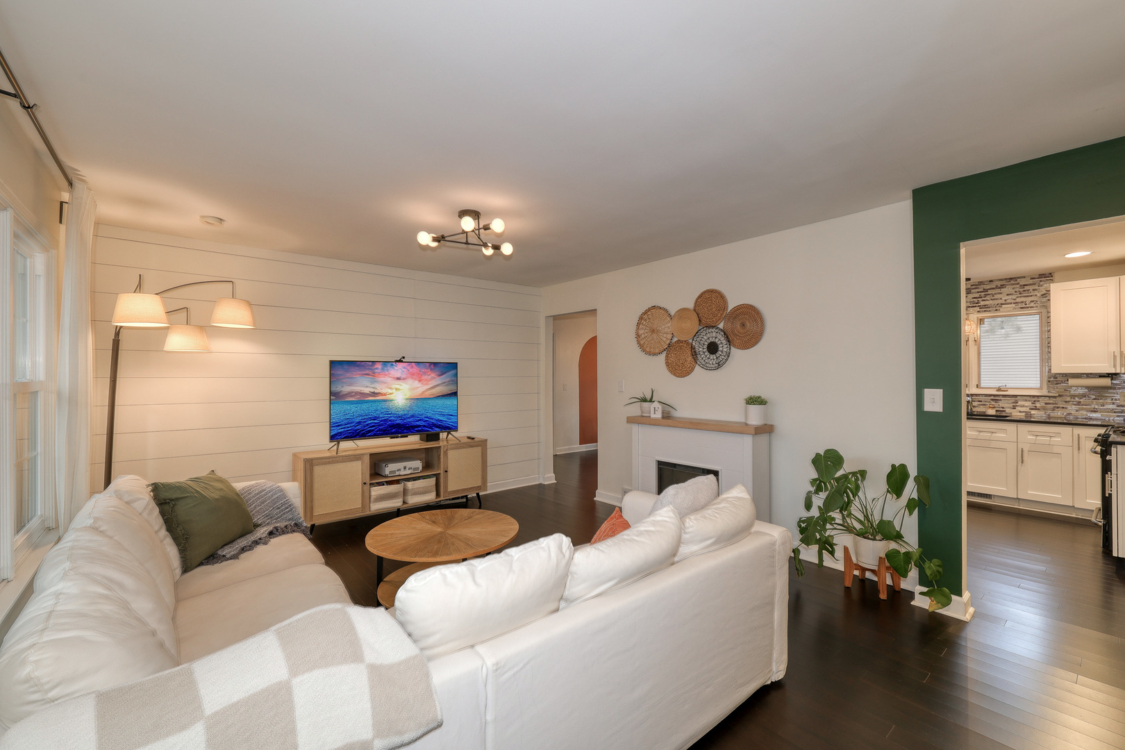 724 South Jefferson Street Batavia, IL 60510 - Photo 2 of 23 a living room with furniture a fireplace and wooden floor