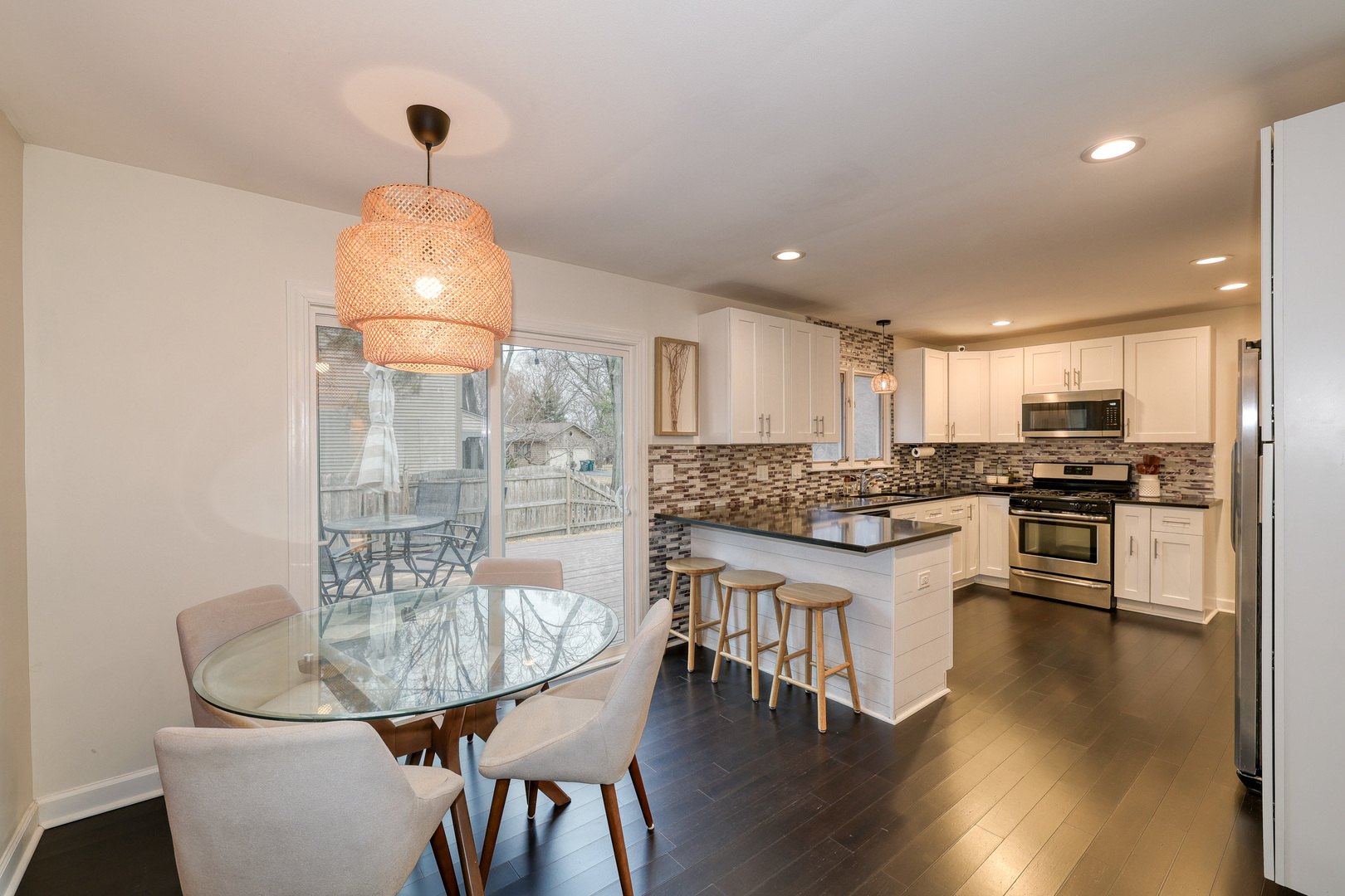 724 South Jefferson Street Batavia, IL 60510 - Photo 6 of 23 a kitchen with granite countertop stainless steel appliances a sink and a refrigerator