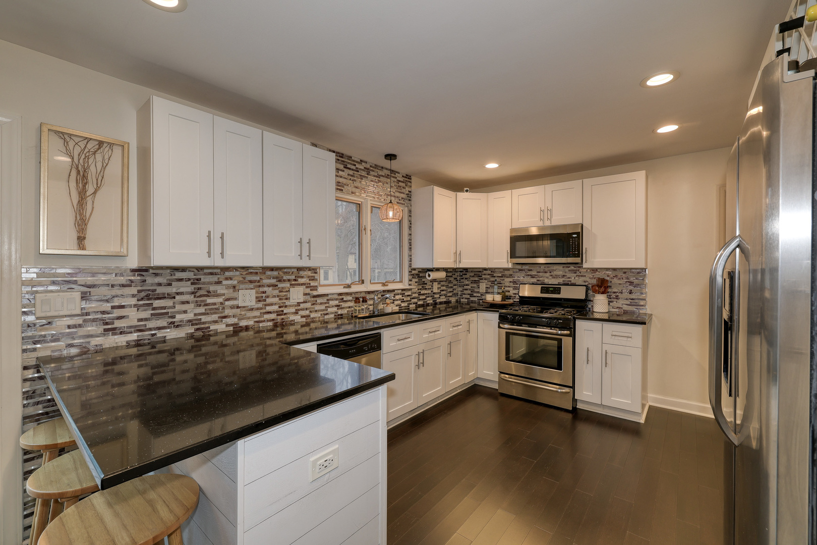 724 South Jefferson Street Batavia, IL 60510 - Photo 7 of 23 a kitchen with granite countertop a sink stainless steel appliances and cabinets