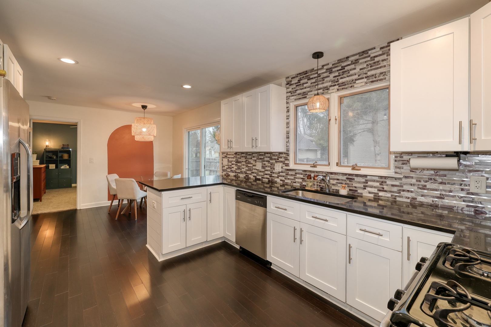 724 South Jefferson Street Batavia, IL 60510 - Photo 8 of 23 a kitchen with granite countertop white cabinets and white appliances