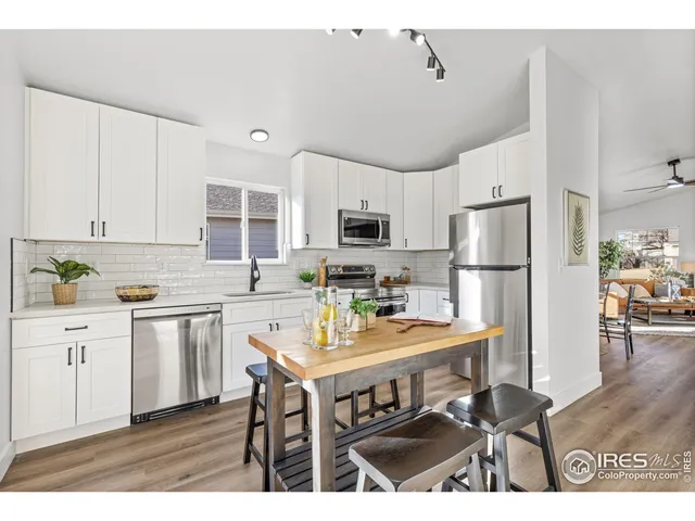 a bedroom with a bed and a table