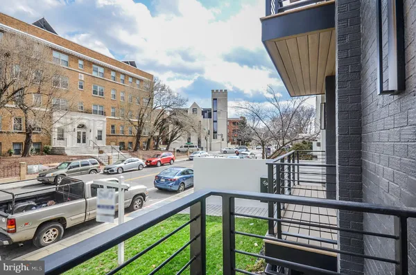 a view of a balcony with two chairs and a table