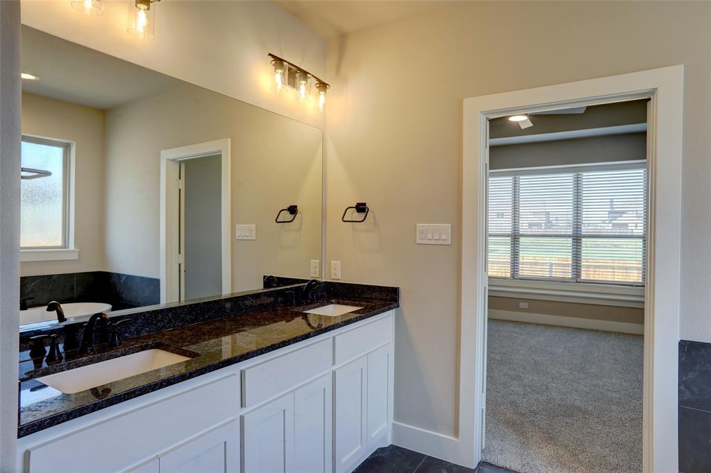 208 Pennington Road Josephine, TX 75173 - Photo 10 of 22 a bathroom with a granite countertop sink and a mirror