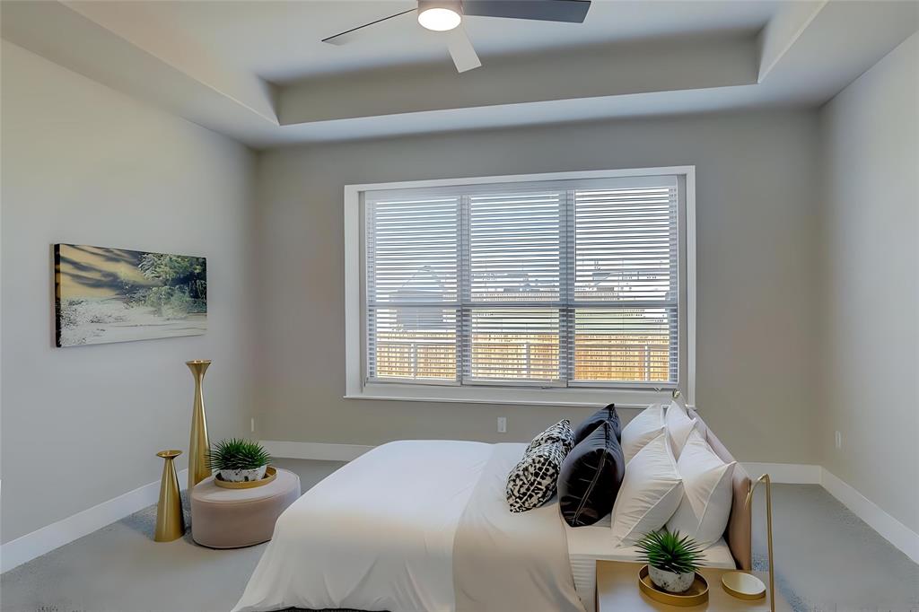 208 Pennington Road Josephine, TX 75173 - Photo 8 of 22 a bed sitting in a bedroom next to a window