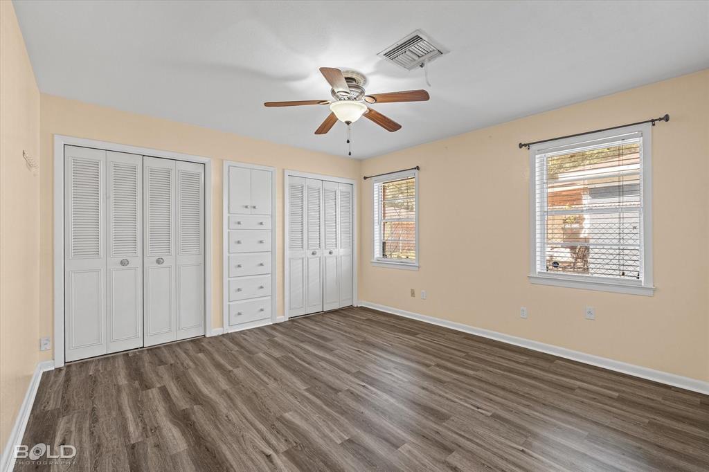 2710 Higgins Drive Shreveport, LA 71104 - Photo 22 of 37 a view of empty room with wooden floor and fan