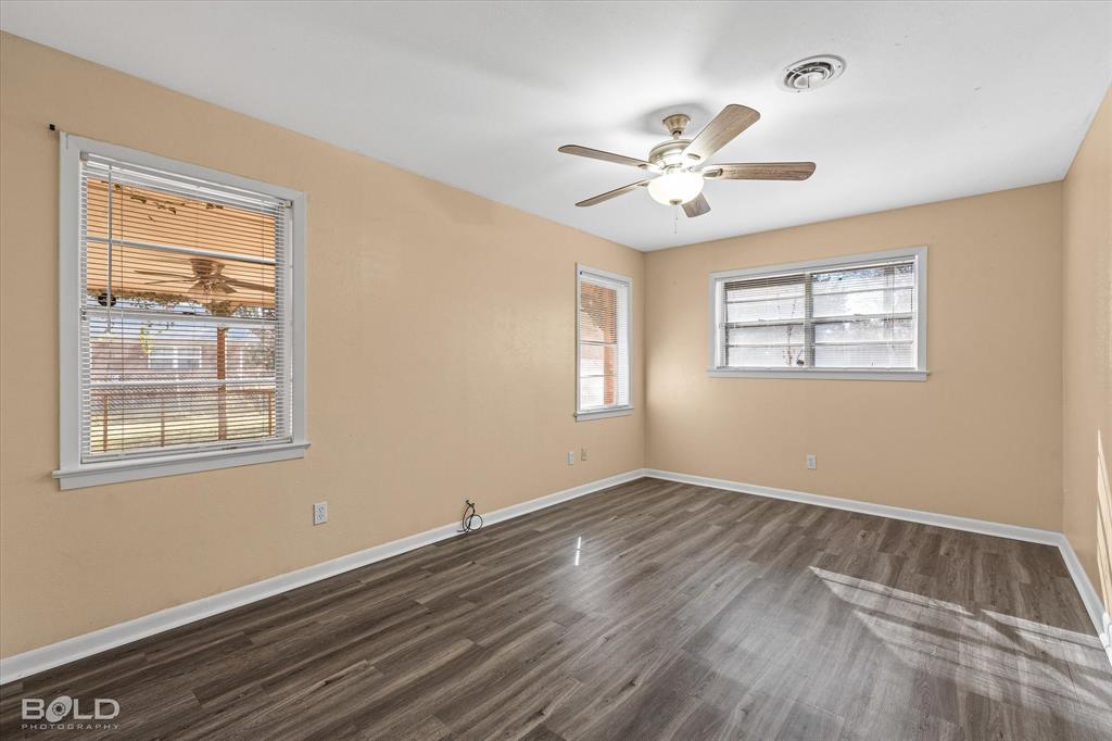2710 Higgins Drive Shreveport, LA 71104 - Photo 25 of 37 a view of an empty room with wooden floor and a window