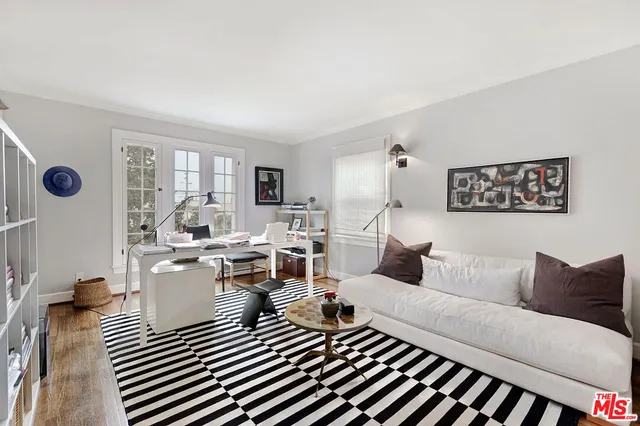 a living room with furniture and a rug