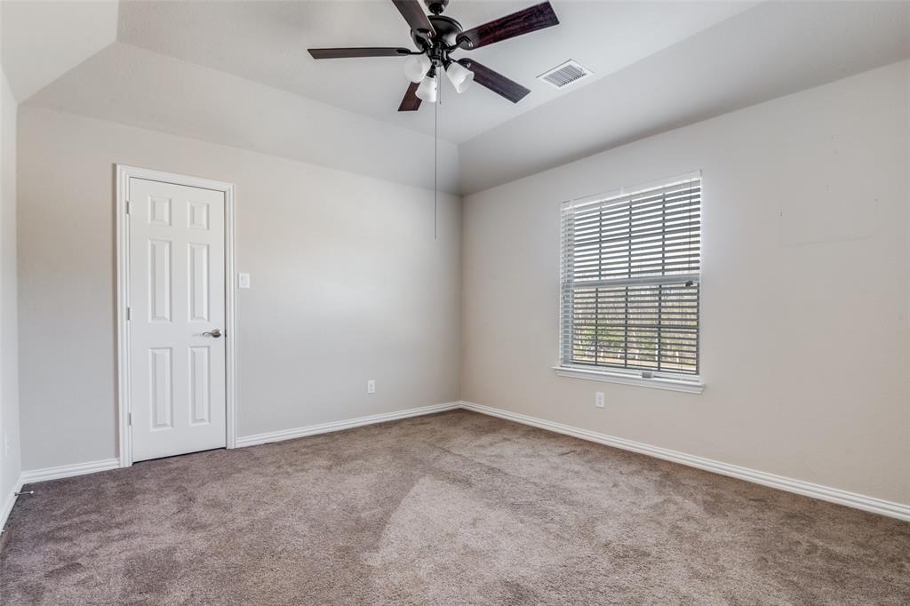 679 Princeton Way Rockwall, TX 75087 - Photo 14 of 25 an empty room with a window and a fan