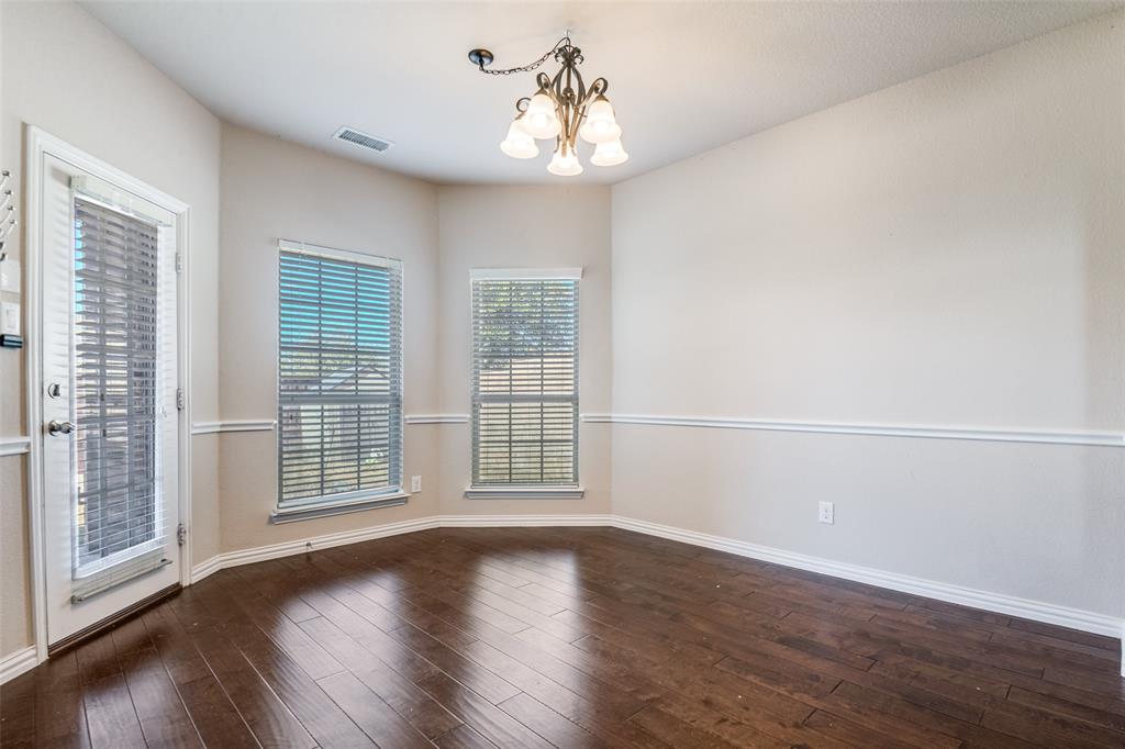 679 Princeton Way Rockwall, TX 75087 - Photo 16 of 25 wooden floor in an empty room with a window