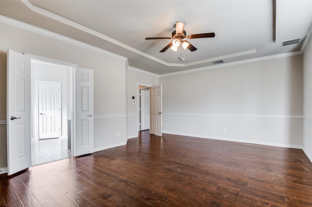 679 Princeton Way Rockwall, TX 75087 - Photo 18 of 25 a view of an empty room with wooden floor