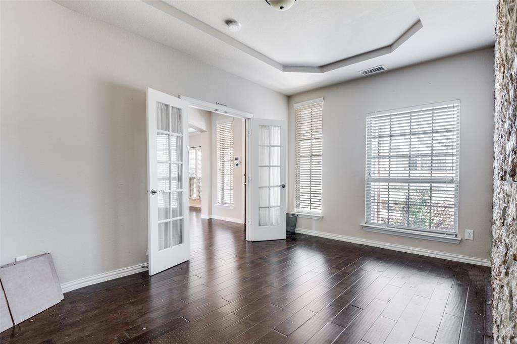 679 Princeton Way Rockwall, TX 75087 - Photo 20 of 25 wooden floor in an empty room with a window