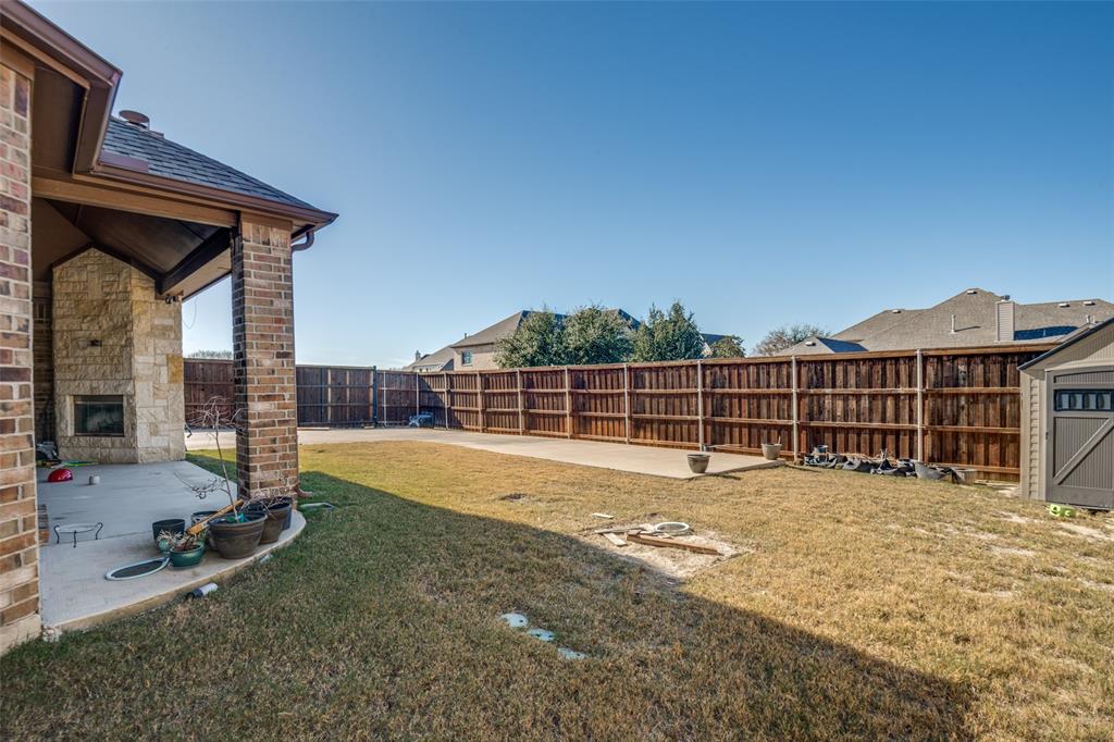 679 Princeton Way Rockwall, TX 75087 - Photo 24 of 25 a view of a house with backyard and porch