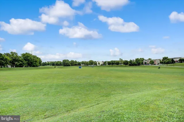 a view of a swimming pool with an outdoor space and seating area
