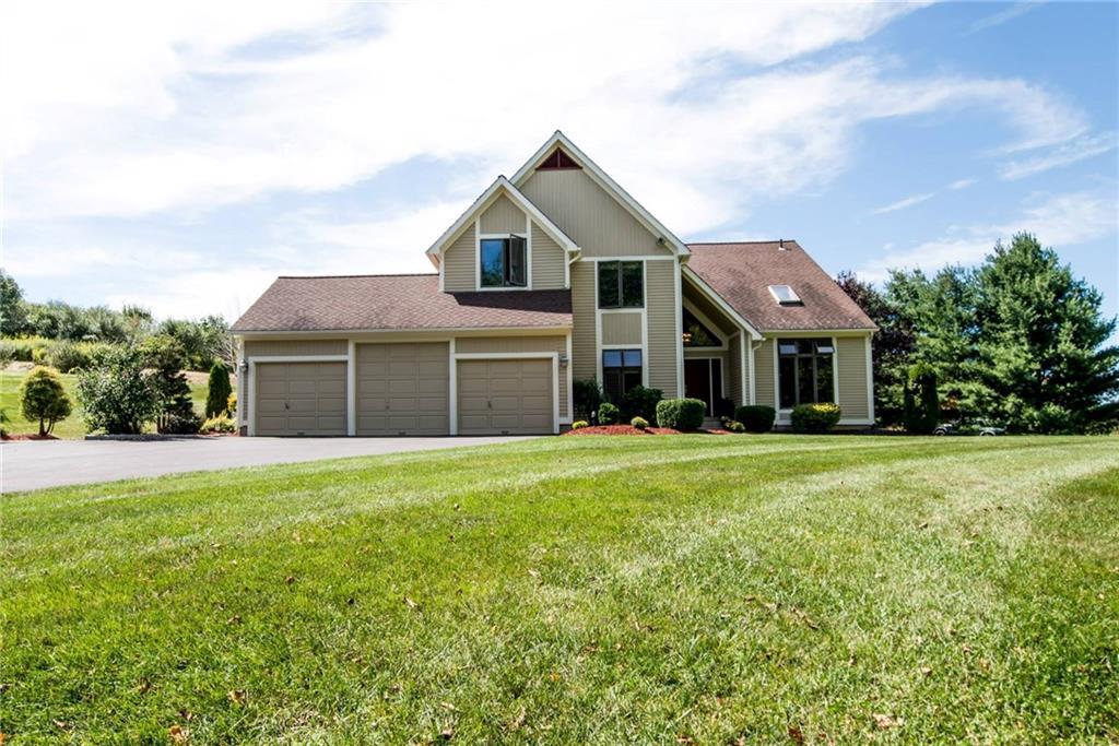 393 Higganum Road Durham, CT 06422 - Photo 1 of 1 a front view of a house with a garden and yard