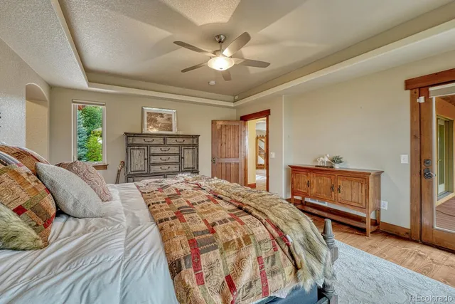 a bedroom with a large bed and dresser