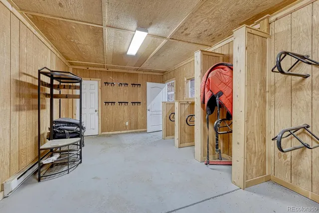 a view of a swimming pool with lawn chairs and plants