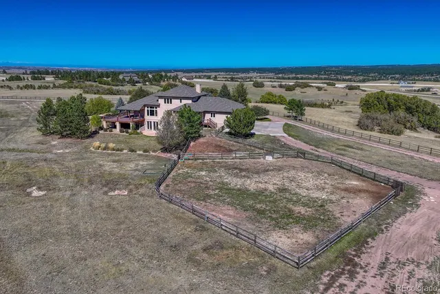 an aerial view of a building and outdoor space