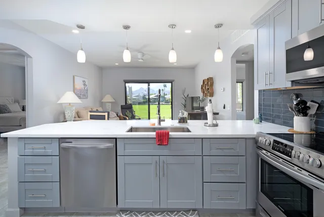 a kitchen with a sink and cabinets