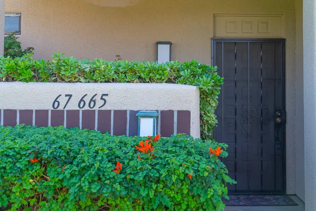 a view of a house with flower garden
