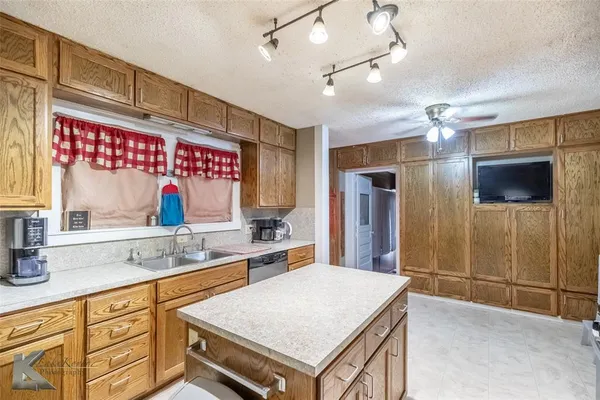 a spacious bathroom with a sink a large mirror and shower