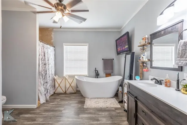 a bathroom with a sink a mirror and a bathtub
