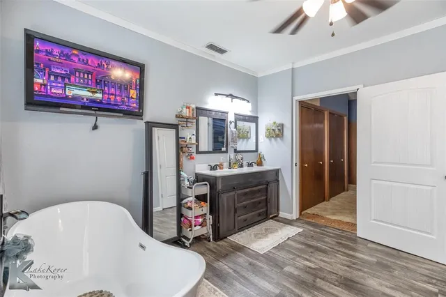 a spacious bathroom with a tub and a shower
