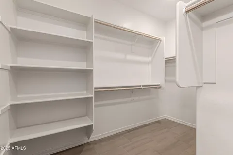 a bathroom with a sink toilet vanity and tub