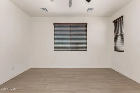 a view of an empty room with windows