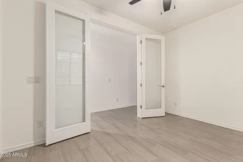 a backyard of a house with lots of green space and lake view