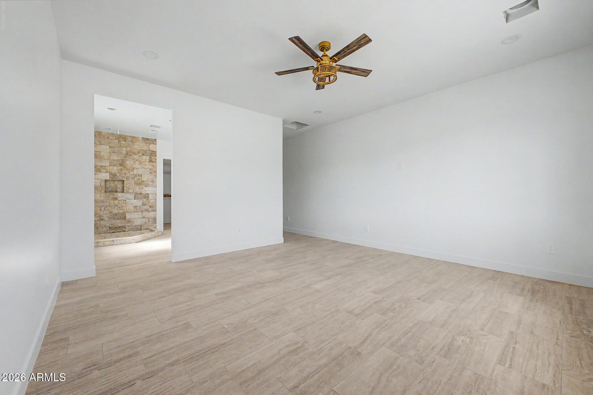 18815 West Arlington Road Buckeye, AZ 85326 - Photo 23 of 56 an empty room with painting on the wall