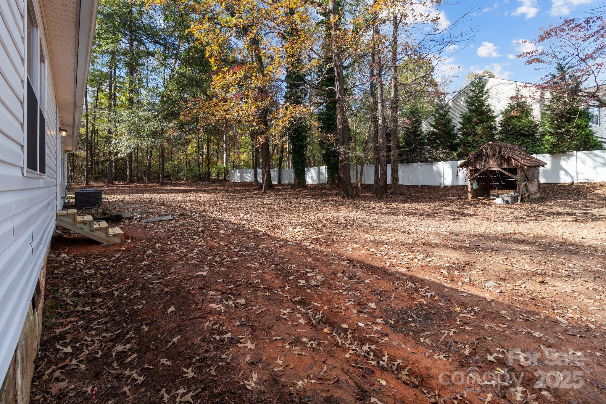 4642 McClure Road Charlotte, NC 28216 - Photo 18 of 48 a view of a yard with trees