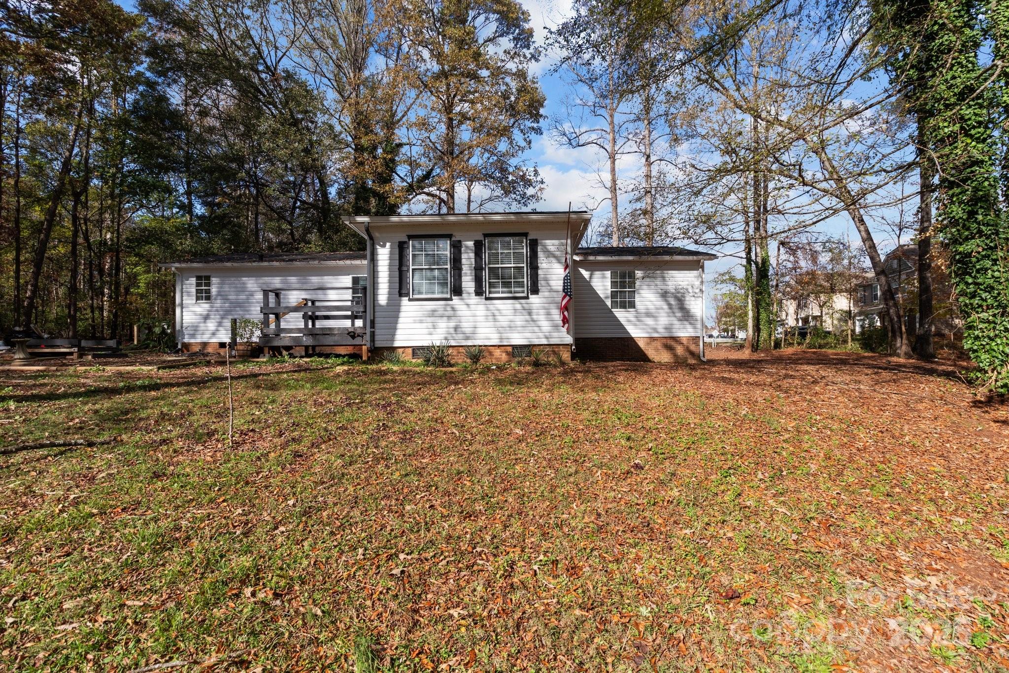 4642 McClure Road Charlotte, NC 28216 - Photo 2 of 48 a front view of a house with large trees