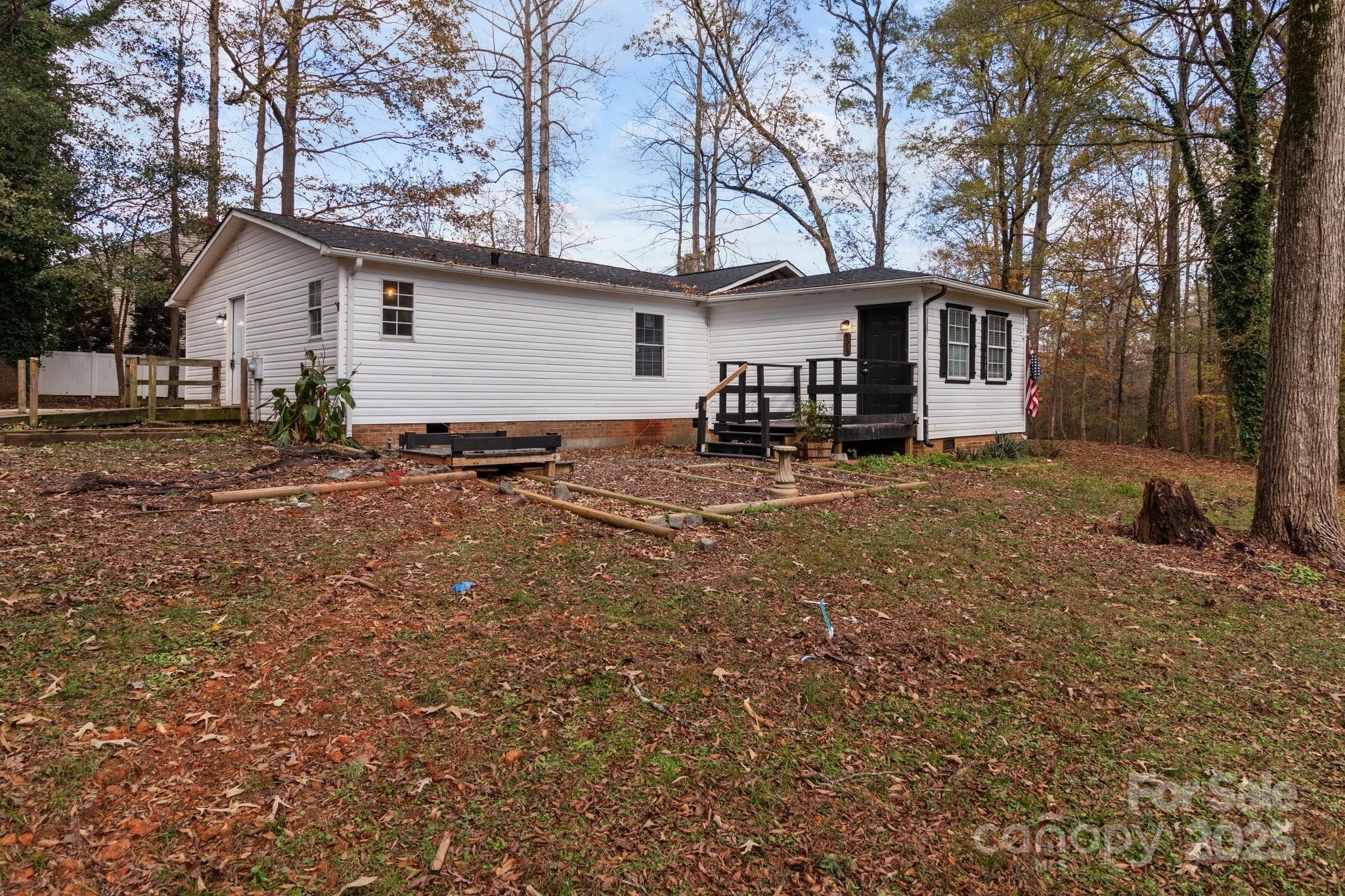 4642 McClure Road Charlotte, NC 28216 - Photo 3 of 48 a view of a house with a yard