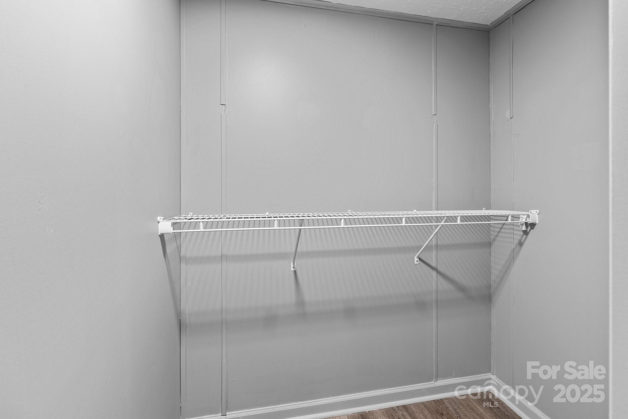 4642 McClure Road Charlotte, NC 28216 - Photo 32 of 48 a view of a room with racks on the wall