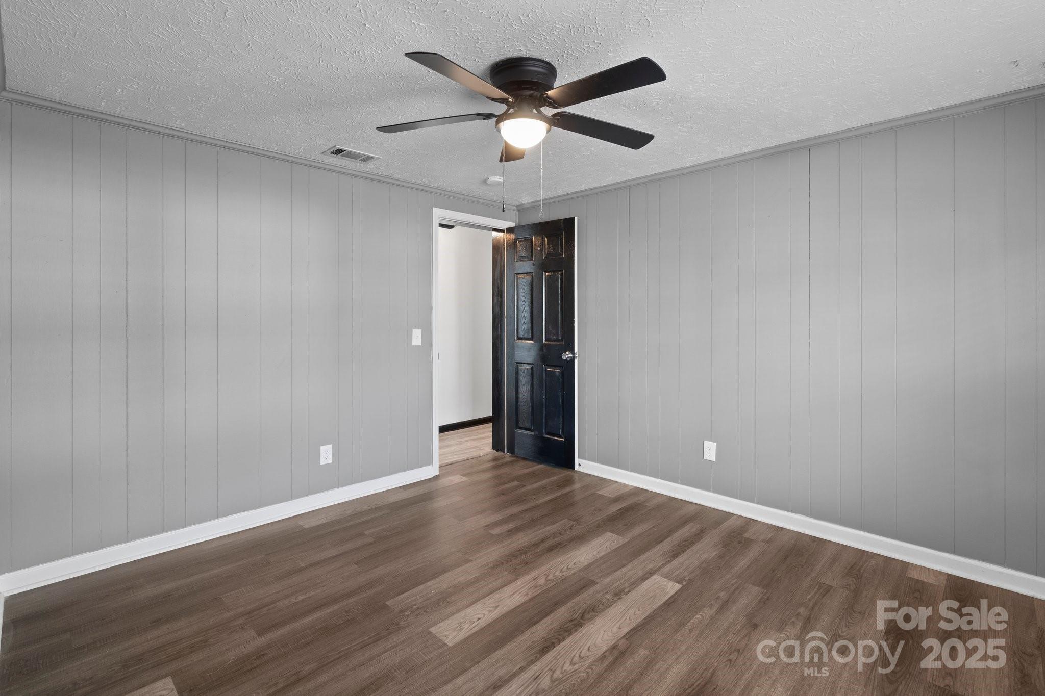 4642 McClure Road Charlotte, NC 28216 - Photo 33 of 48 a view of an empty room and wooden floor